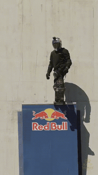 Red Bull Ad On Building In City GIF