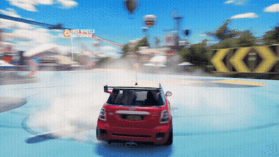 Red Car Driving Around Track With Hot Wheels Autoshow Sign GIF
