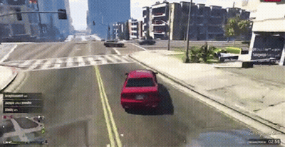 Red Car Driving Down City Street GIF