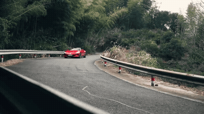 Red Car Driving Down Curvy Road GIF