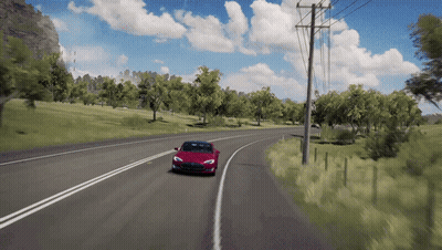 Red Car Driving Down Road With Trees GIF