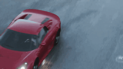 Red Car Driving Down Wet Road GIF