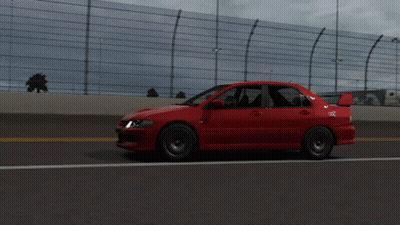 Red Car Driving On Highway With Fence GIF