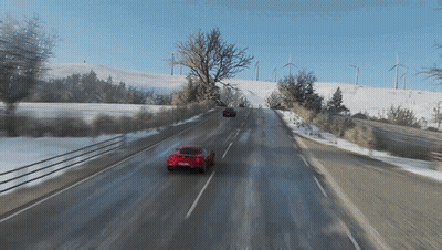 Red Car Driving On Snowy Road In Video Game GIF