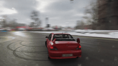 Red Car Driving on Snowy Road Sdn Plate