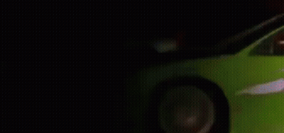 Red Car Driving Past White Car On Road GIF
