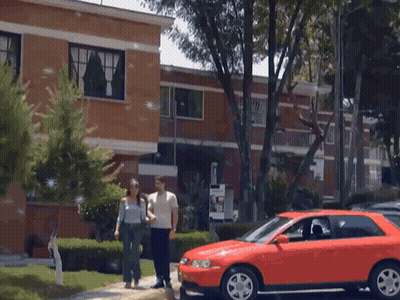 Red Car Parked In Front Of Building GIF
