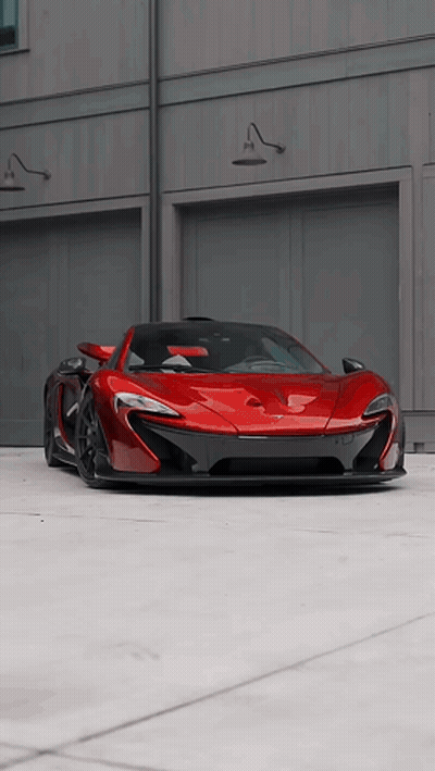 Red Car Parked In Front Of Garage GIF
