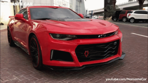 Red Car Parked In Front Of YouTube Channel GIF