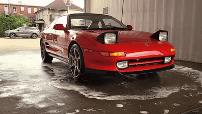 Red Car Parked Near No Parking Sign GIF