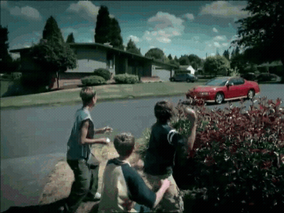 Red Car Parked On Residential Road GIF