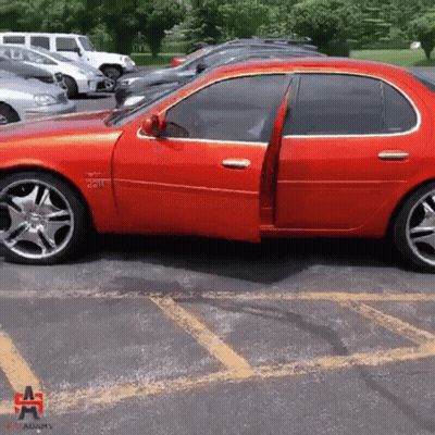 Red Car Parked With Adams GIF