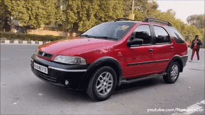 Red Car Parked With M License Plate GIF