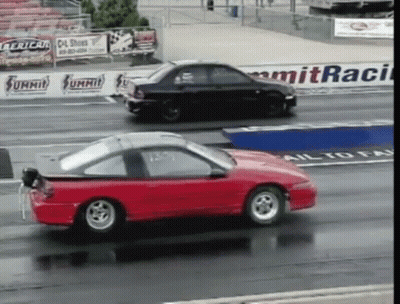 Red Car Passing Black Car On Summit Race Track GIF