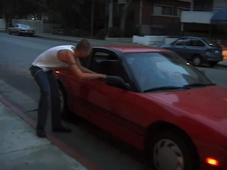 Red Car With License Plate Saying A GIF