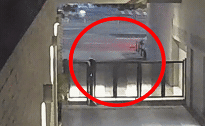 Red Circle Person Walking Through Fence GIF