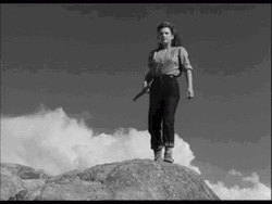 Red Dawn Girl At Top Of Rock GIF