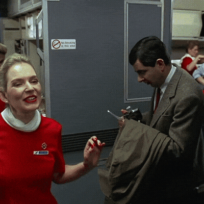 Red Dress Woman And Suit Man By No Smoking Sign GIF