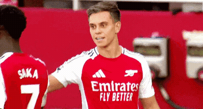 Red Emirates Fly Better Jersey Player With Teammate GIF