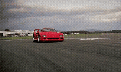 Red Ferrari F40 Driving on Cloudy Track