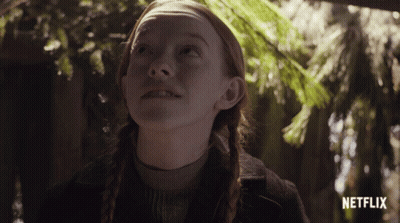 Red Hair Girl Looking Up At Sky With Netflix Logo GIF