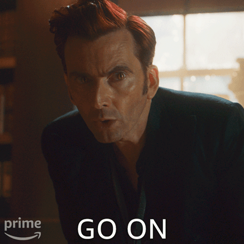 Red Hair Man In Front Of Prime Go On Sign GIF