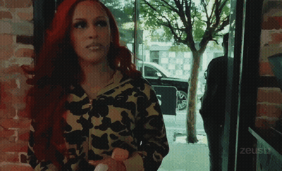 Red Hair Woman At Window With Zeustv GIF