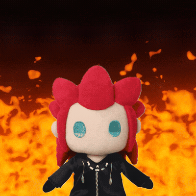Red-Haired Blue-Eyed Stuffed Animal By Fire GIF