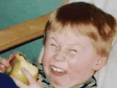 Red-Haired Boy Making Funny Face With Banana GIF