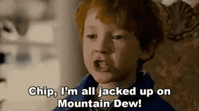 Red-Haired Boy Sitting In Chair Talking GIF