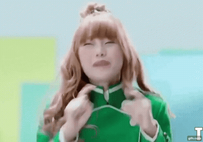 Red-Haired Girl In Green Jacket Funny Face GIF
