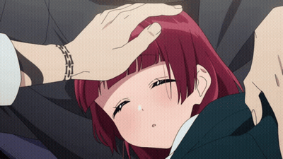 Red-Haired Girl Laying On Ground With Man's Hand On Forehead GIF