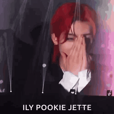 Red-Haired Man Covering Face At Microphone GIF