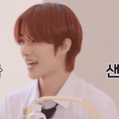 Red-Haired Man Holding Water Bottle In Basket GIF