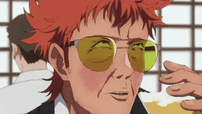 Red-Haired Man in Yellow Sunglasses Holding Beer