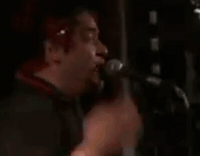 Red-Haired Man Singing Into Microphone GIF