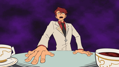 Red-Haired Man Sitting At Table With Two Coffees GIF