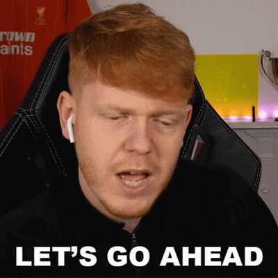 Red-Haired Man Sitting In Chair Saying Let's Go Ahead GIF