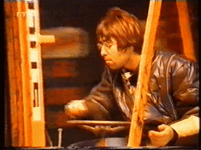 Red-Haired Man Sitting In Chair With Steering Wheel GIF