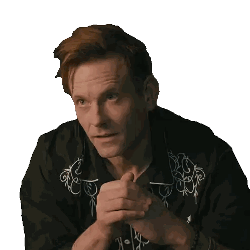 Red-Haired Man Wearing Black Shirt With White Embroidery Sticker