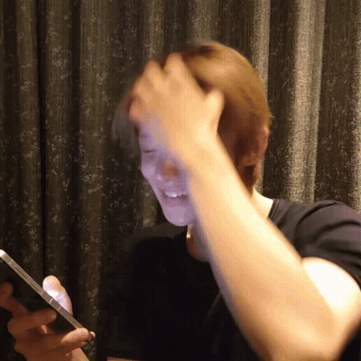 Red Haired Person In Black Jacket GIF