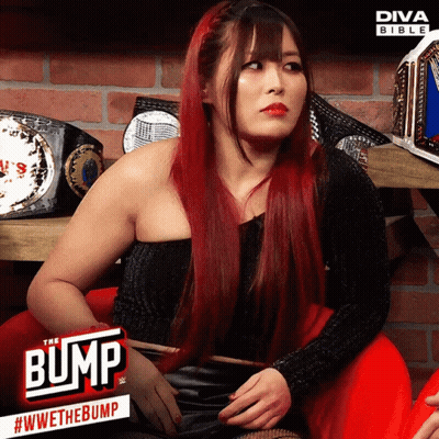 Red-Haired Woman At Diva Bible Sign GIF