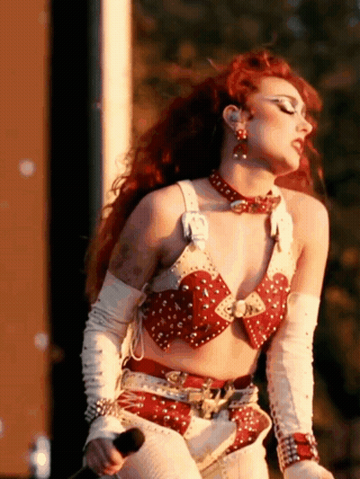 Red-Haired Woman Holding Microphone GIF