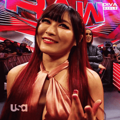 Red-Haired Woman In Front Of Diva Bible Sign GIF