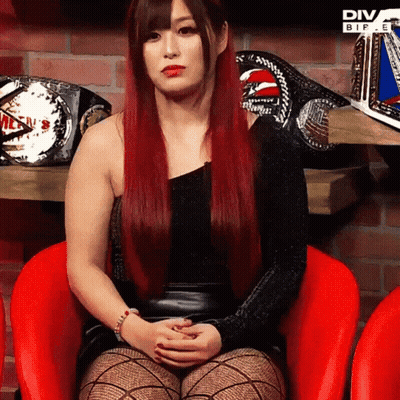 Red-Haired Woman In Red Chair With Diva Wrestling Belts GIF