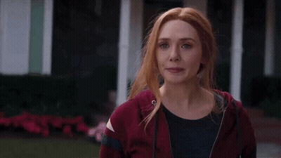 Red-Haired Woman In Red Hoodie And Black Shirt GIF