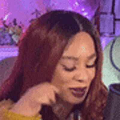 Red-Haired Woman Looking At Phone GIF