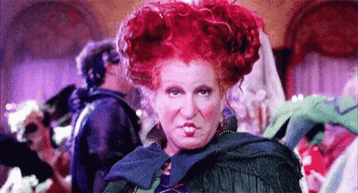 Red-Haired Woman Making Funny Face Before Crowd