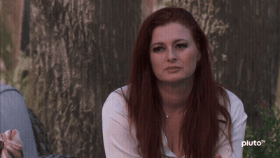 Red-Haired Woman Sitting By Tree Pluto TV GIF