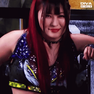 Red-Haired Woman Smiling At Diva Bible Ad GIF